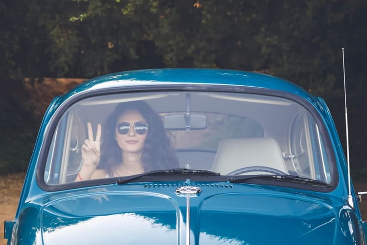 The Girl inside the car with a clear windshield