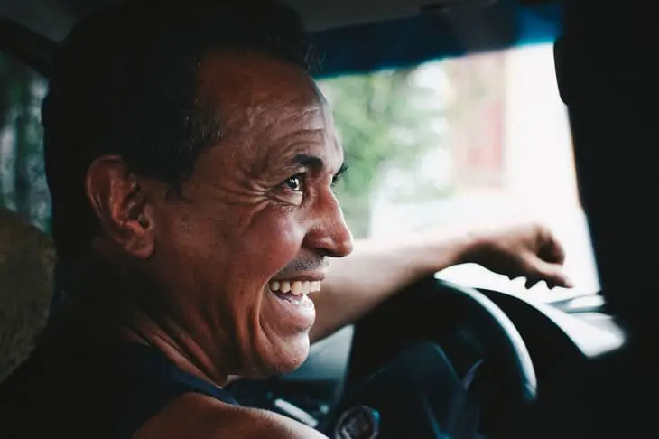 A man happy while driving the car